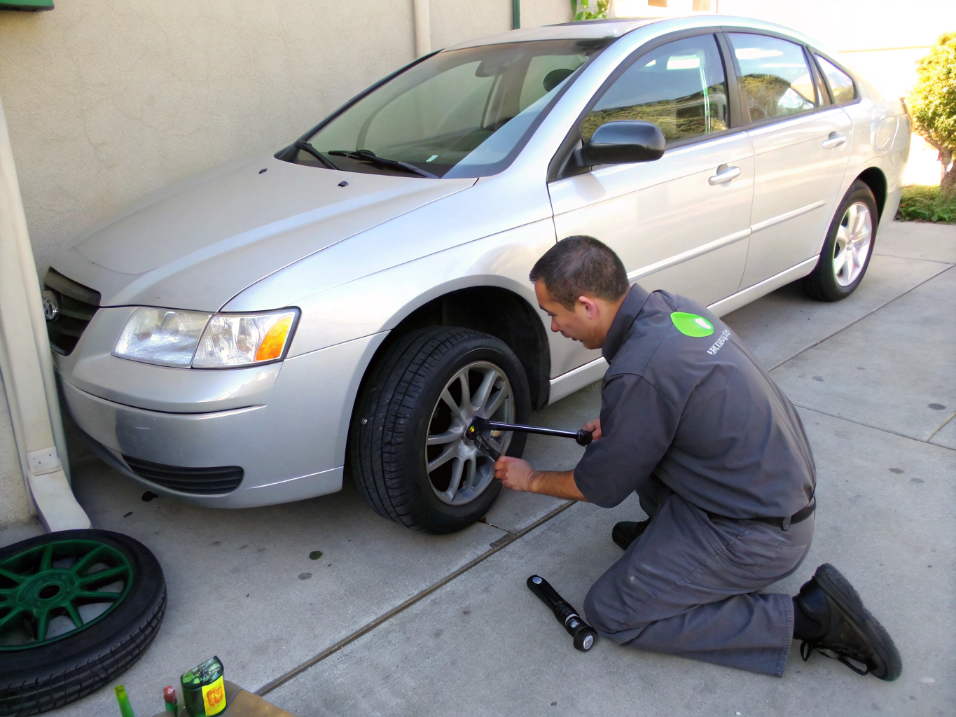 Dealer staff swapping seasonal tires on multiple fleet vehicles